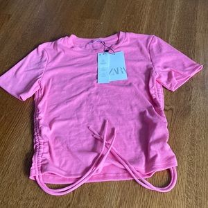 Pink ribbed t-shirt with cinched adjustable sides